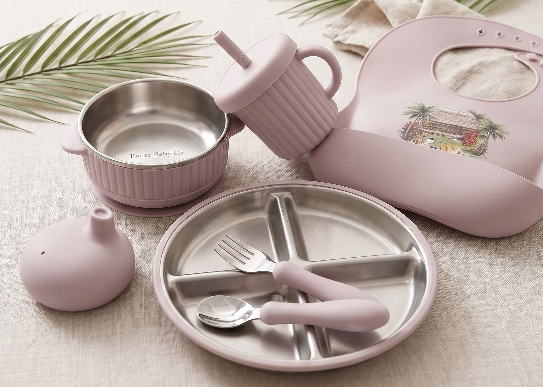 Children's tableware set with silicone and stainless steel featuring samoan fale on bib and praise baby co logo